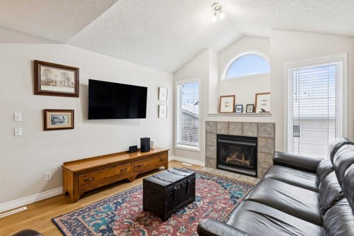 45 Prestwick Rise Se, Calgary, AB - Indoor Photo Showing Living Room With Fireplace