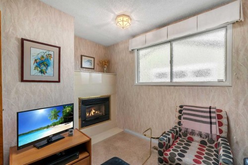 5602 Dalcastle Hill Nw, Calgary, AB - Indoor With Fireplace