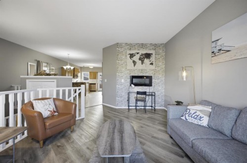 8 Horne Close, Sylvan Lake, AB - Indoor Photo Showing Living Room With Fireplace