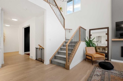 271 West Grove Point Sw, Calgary, AB - Indoor Photo Showing Other Room With Fireplace