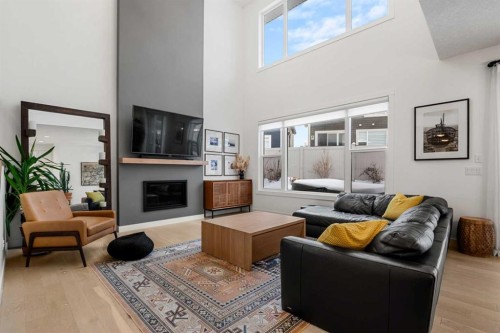 271 West Grove Point Sw, Calgary, AB - Indoor Photo Showing Living Room With Fireplace