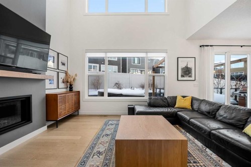 271 West Grove Point Sw, Calgary, AB - Indoor Photo Showing Living Room With Fireplace