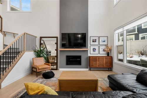 271 West Grove Point Sw, Calgary, AB - Indoor Photo Showing Living Room With Fireplace
