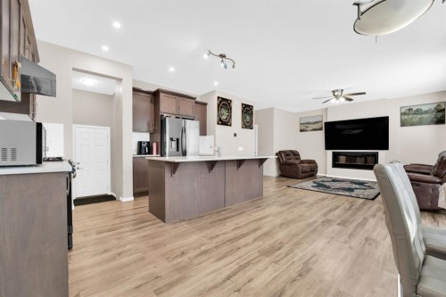 113 Cityline Square Ne, Calgary, AB - Indoor Photo Showing Kitchen With Fireplace