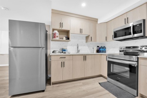 113 Cityline Square Ne, Calgary, AB - Indoor Photo Showing Kitchen With Stainless Steel Kitchen