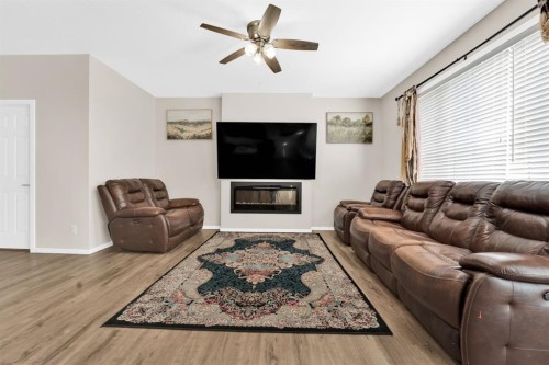 113 Cityline Square Ne, Calgary, AB - Indoor Photo Showing Living Room With Fireplace