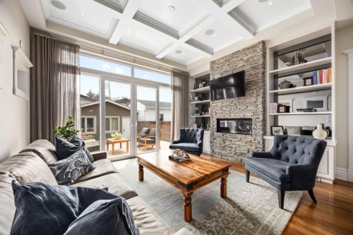 2037 48 Avenue Sw, Calgary, AB - Indoor Photo Showing Living Room With Fireplace