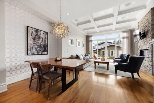 2037 48 Avenue Sw, Calgary, AB - Indoor Photo Showing Dining Room With Fireplace