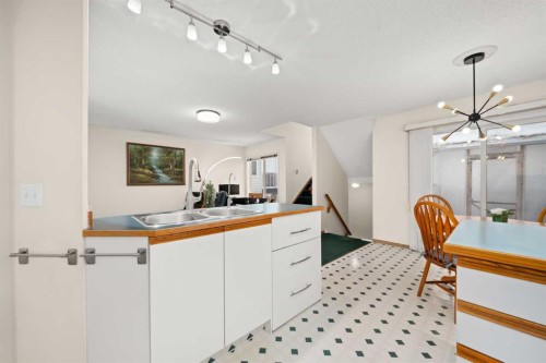 9473 Hidden Valley Drive Nw, Calgary, AB - Indoor Photo Showing Kitchen With Double Sink