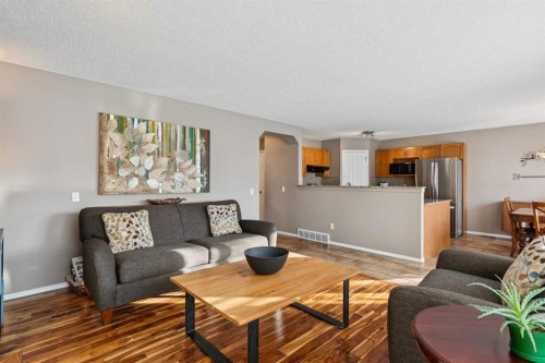 33 River Rock Crescent Se, Calgary, AB - Indoor Photo Showing Living Room