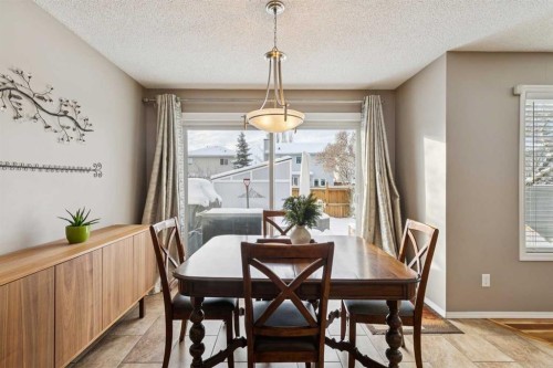 33 River Rock Crescent Se, Calgary, AB - Indoor Photo Showing Dining Room