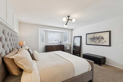 33 River Rock Crescent Se, Calgary, AB - Indoor Photo Showing Bedroom