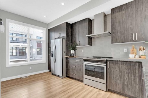 4135 Seton Drive Se, Calgary, AB - Indoor Photo Showing Kitchen With Stainless Steel Kitchen With Upgraded Kitchen