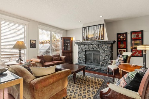 353 Discovery Ridge Boulevard Sw, Calgary, AB - Indoor Photo Showing Living Room With Fireplace