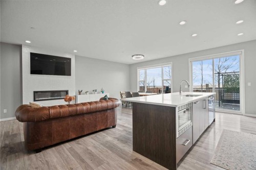 66 Howse Common Ne, Calgary, AB - Indoor With Fireplace