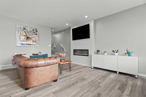 66 Howse Common Ne, Calgary, AB - Indoor With Fireplace