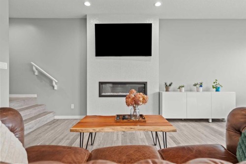66 Howse Common Ne, Calgary, AB - Indoor Photo Showing Living Room With Fireplace