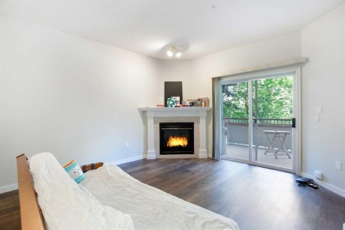306-777 3 Avenue Sw, Calgary, AB - Indoor With Fireplace