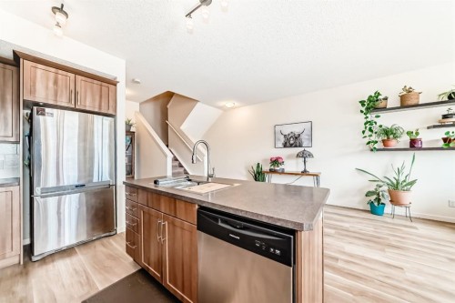 637-101 Sunset Drive, Cochrane, AB - Indoor Photo Showing Kitchen With Double Sink