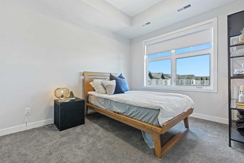 305-255 Les Jardins Park Se, Calgary, AB - Indoor Photo Showing Bedroom