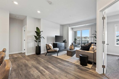 305-255 Les Jardins Park Se, Calgary, AB - Indoor Photo Showing Living Room