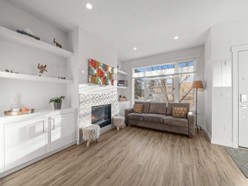1883 47 Street Nw, Calgary, AB - Indoor Photo Showing Living Room With Fireplace