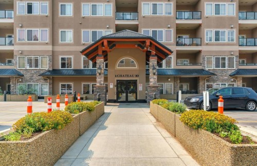 202-10 Discovery Ridge Close Sw, Calgary, AB - Outdoor With Balcony With Facade