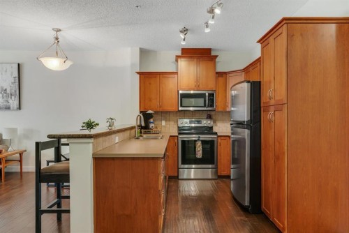 202-10 Discovery Ridge Close Sw, Calgary, AB - Indoor Photo Showing Kitchen With Stainless Steel Kitchen