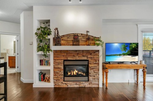 202-10 Discovery Ridge Close Sw, Calgary, AB - Indoor Photo Showing Living Room With Fireplace