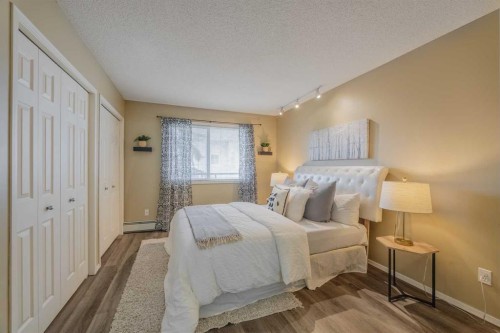 1311-950 Arbour Lake Road Nw, Calgary, AB - Indoor Photo Showing Bedroom