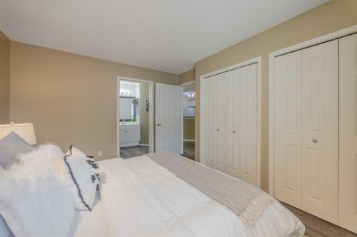 1311-950 Arbour Lake Road Nw, Calgary, AB - Indoor Photo Showing Bedroom