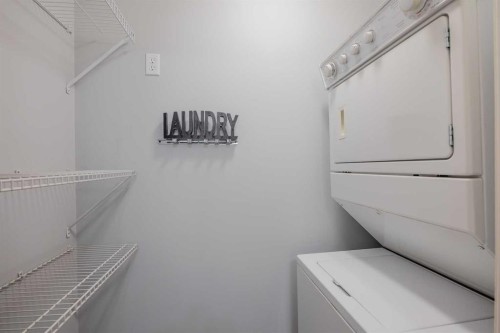 1311-950 Arbour Lake Road Nw, Calgary, AB - Indoor Photo Showing Laundry Room