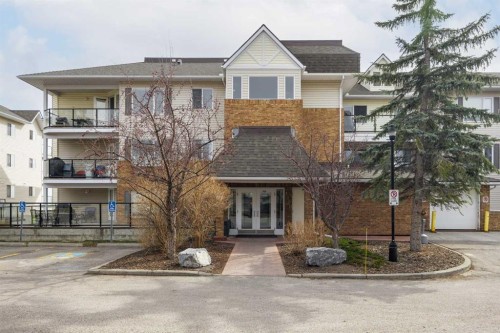 1311-950 Arbour Lake Road Nw, Calgary, AB - Outdoor With Balcony With Facade