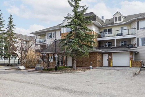 1311-950 Arbour Lake Road Nw, Calgary, AB - Outdoor With Balcony With Facade