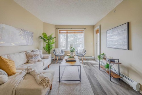 1311-950 Arbour Lake Road Nw, Calgary, AB - Indoor Photo Showing Living Room