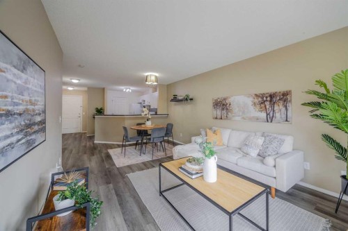 1311-950 Arbour Lake Road Nw, Calgary, AB - Indoor Photo Showing Living Room
