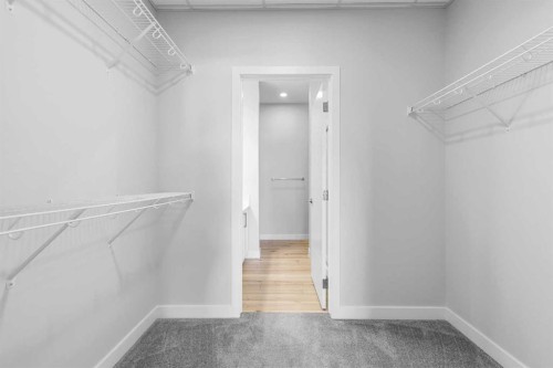 408-255 Les Jardins Park Se, Calgary, AB - Indoor With Storage