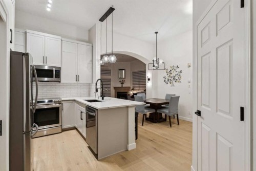 207-881 15 Avenue Sw, Calgary, AB - Indoor Photo Showing Kitchen With Stainless Steel Kitchen With Upgraded Kitchen