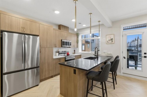 208-562 Seton Circle Se, Calgary, AB - Indoor Photo Showing Kitchen With Upgraded Kitchen