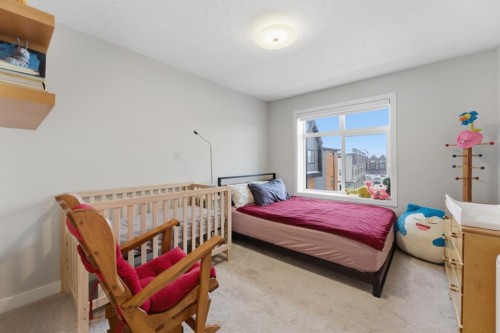 208-562 Seton Circle Se, Calgary, AB - Indoor Photo Showing Bedroom