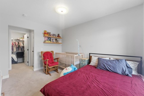 208-562 Seton Circle Se, Calgary, AB - Indoor Photo Showing Bedroom