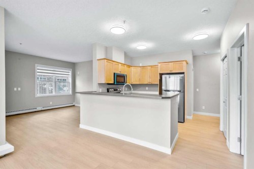 115-1414 17 Street Se, Calgary, AB - Indoor Photo Showing Kitchen