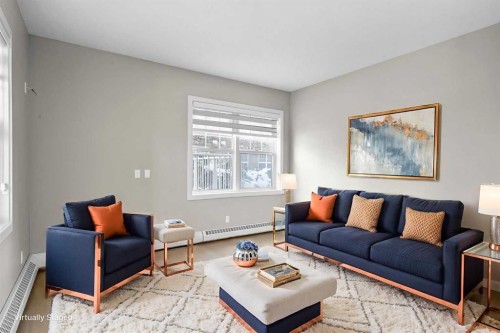 115-1414 17 Street Se, Calgary, AB - Indoor Photo Showing Living Room