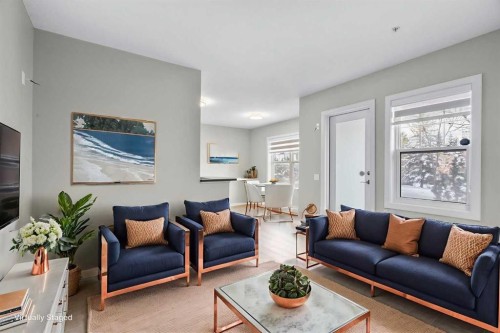 115-1414 17 Street Se, Calgary, AB - Indoor Photo Showing Living Room