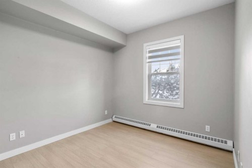 115-1414 17 Street Se, Calgary, AB - Indoor Photo Showing Other Room