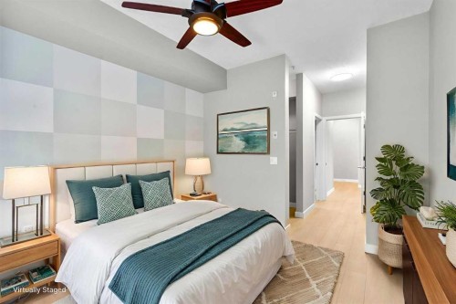 115-1414 17 Street Se, Calgary, AB - Indoor Photo Showing Bedroom