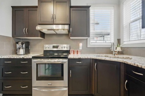 109 Crystal Green Bay, Okotoks, AB - Indoor Photo Showing Kitchen With Upgraded Kitchen