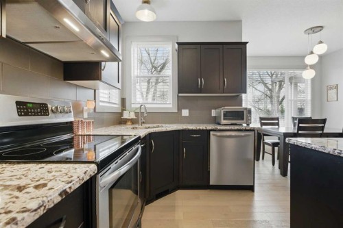 109 Crystal Green Bay, Okotoks, AB - Indoor Photo Showing Kitchen With Upgraded Kitchen