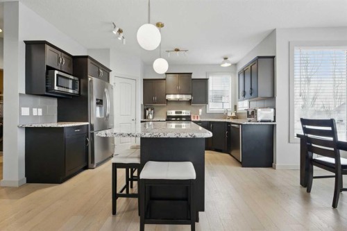 109 Crystal Green Bay, Okotoks, AB - Indoor Photo Showing Kitchen With Upgraded Kitchen