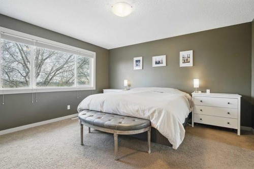 109 Crystal Green Bay, Okotoks, AB - Indoor Photo Showing Bedroom